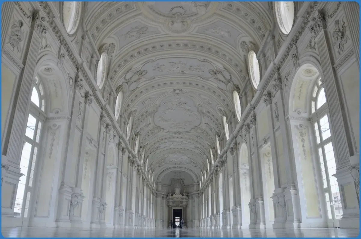 Ornate white hallway with high arched ceiling