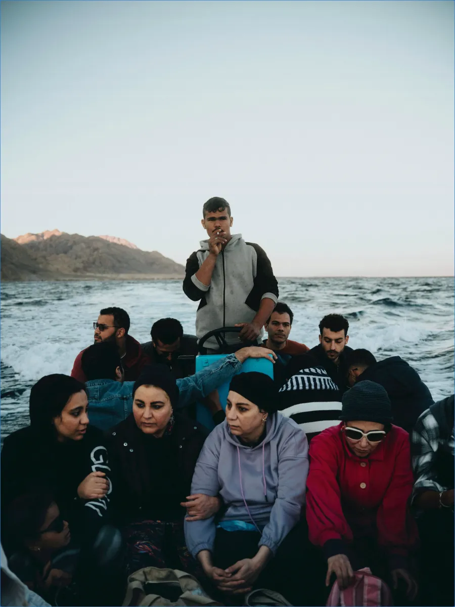 Group of people on a boat at sea.