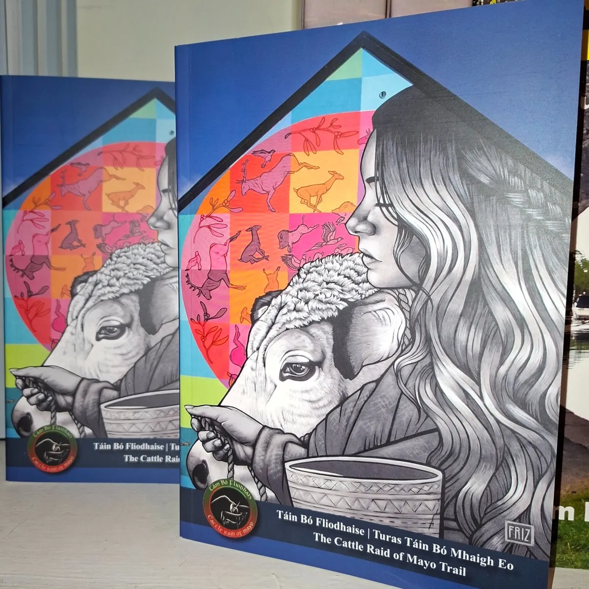 Book cover with illustration of woman and cow.